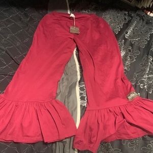 There Matilda Jane pants there’s a size medium and there a maroon red color